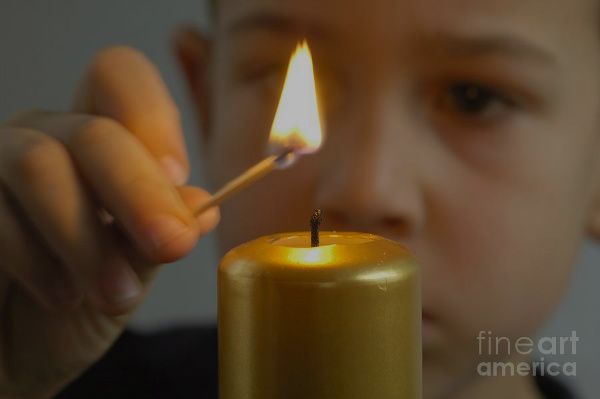 child-lights-a-candle-matthias-hauser-1.jpg